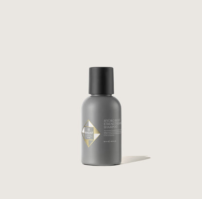 Hydro Root Strengthening Shampoo 50 ml: travel-size packaging on a light background.