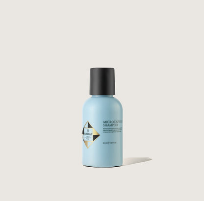 Microcapsules Shampoo 50 мл: блакитний флакон із чорною кришкою.