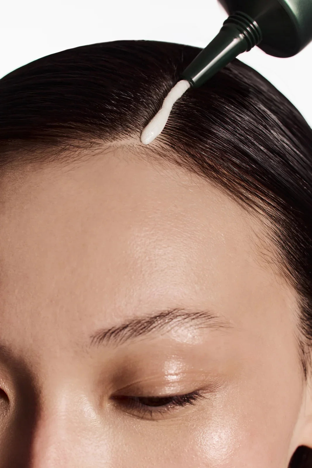 Applying Detox Therapy Scalp Scrub to the scalp