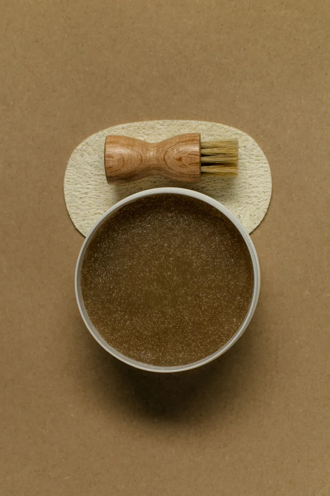 Open Hair & Scalp Mud Scrub jar showing formula with scalp brush