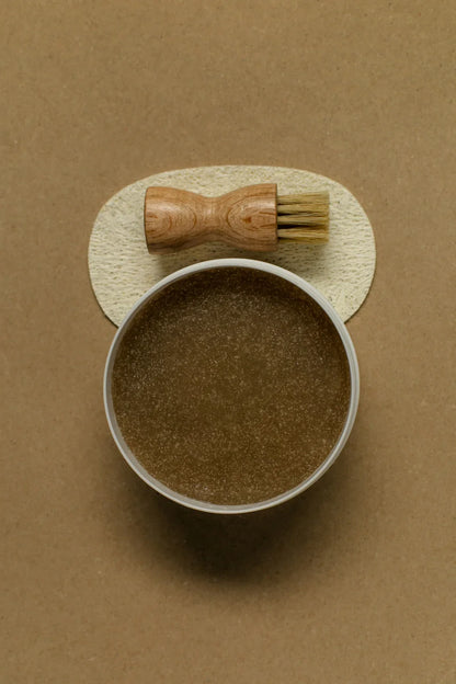 Open Hair & Scalp Mud Scrub jar showing formula with scalp brush