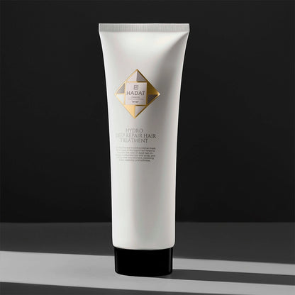 Hydro Deep Repair Hair Treatment tube with gold logo on dark background