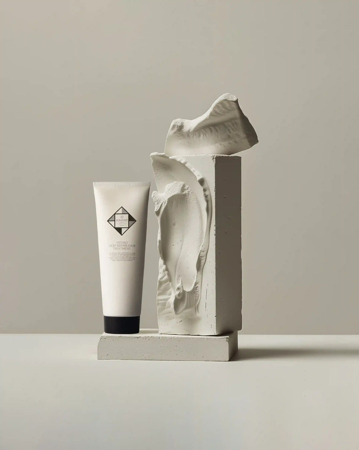 Hydro deep repair hair treatment tube with sculptural art display