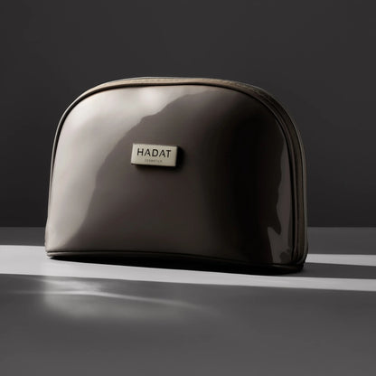 Hadat Cosmetics glossy travel makeup bag with zipper