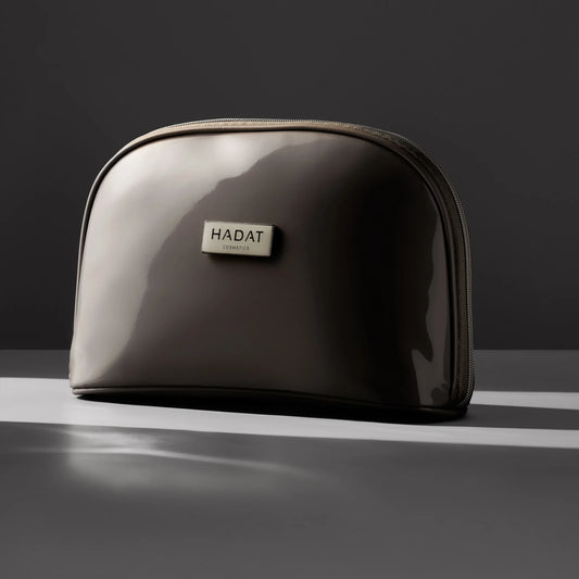 Hadat Cosmetics glossy travel makeup bag with zipper