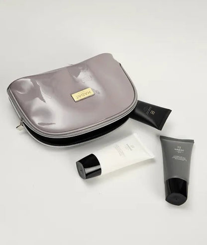 Hadat cosmetics travel set with Sea Oil Silk products in sleek tubes and pouch
