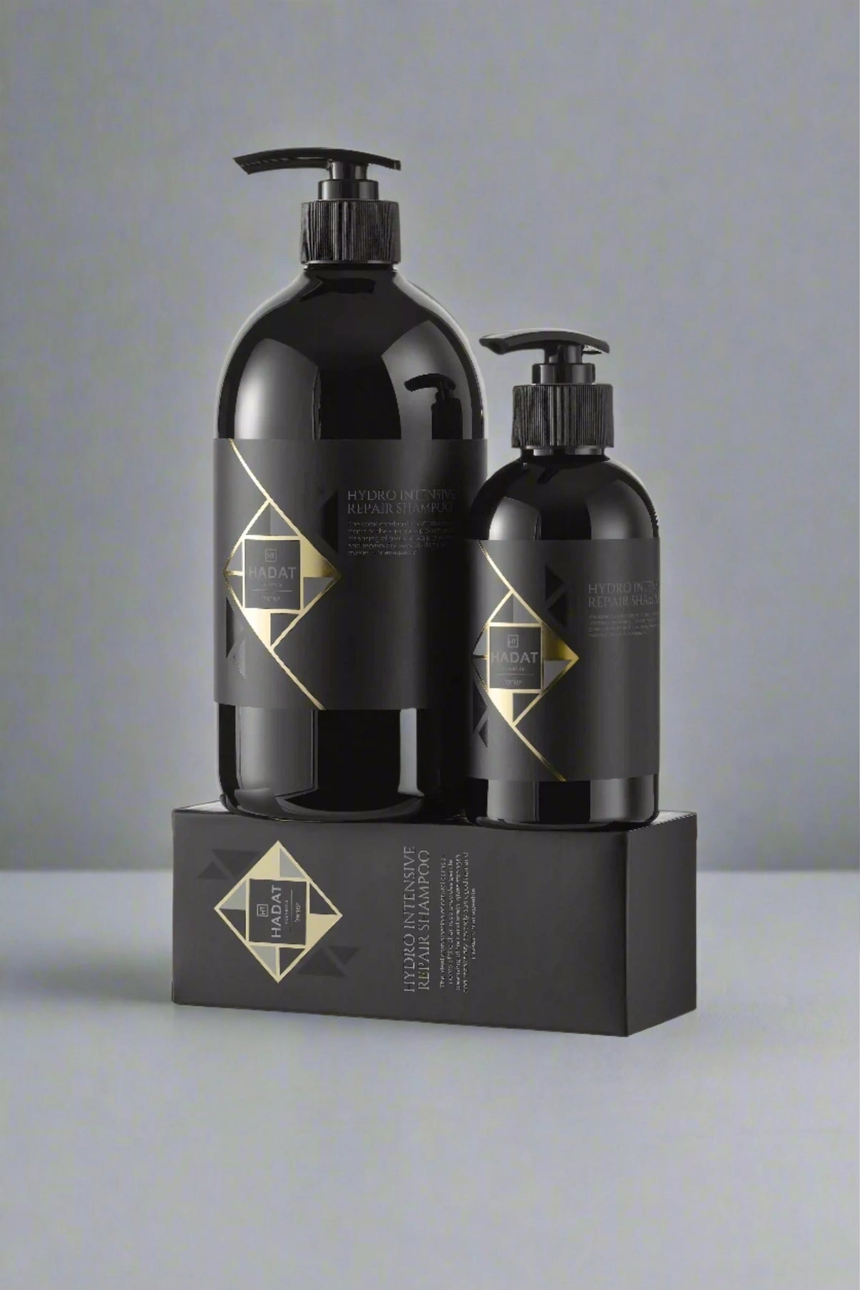 Hydro Intensive Repair Shampoo bottles with sleek black design and gold accents
