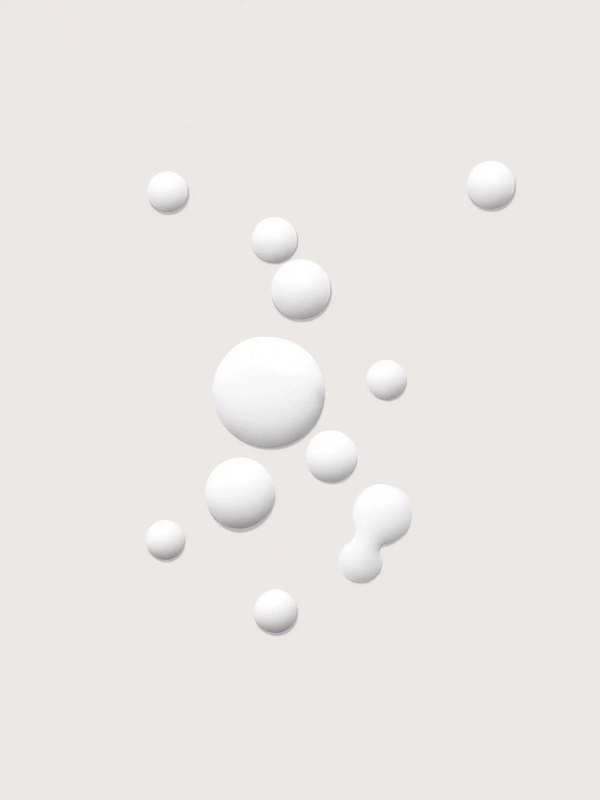 White spherical droplets on light background