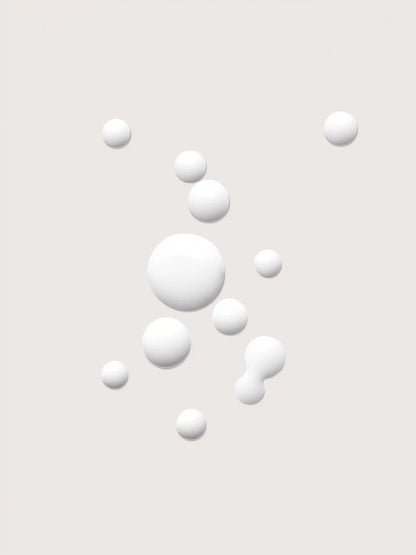 White spherical droplets on light background