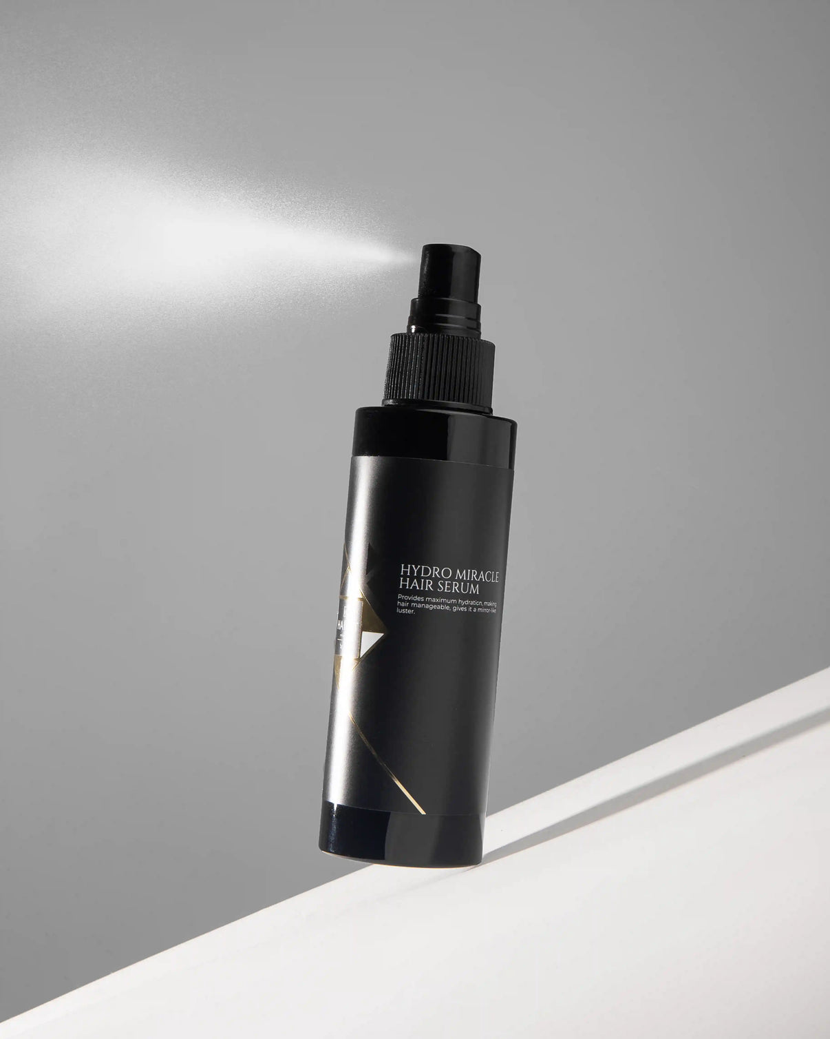 Hydro Miracle Hair Serum spray bottle