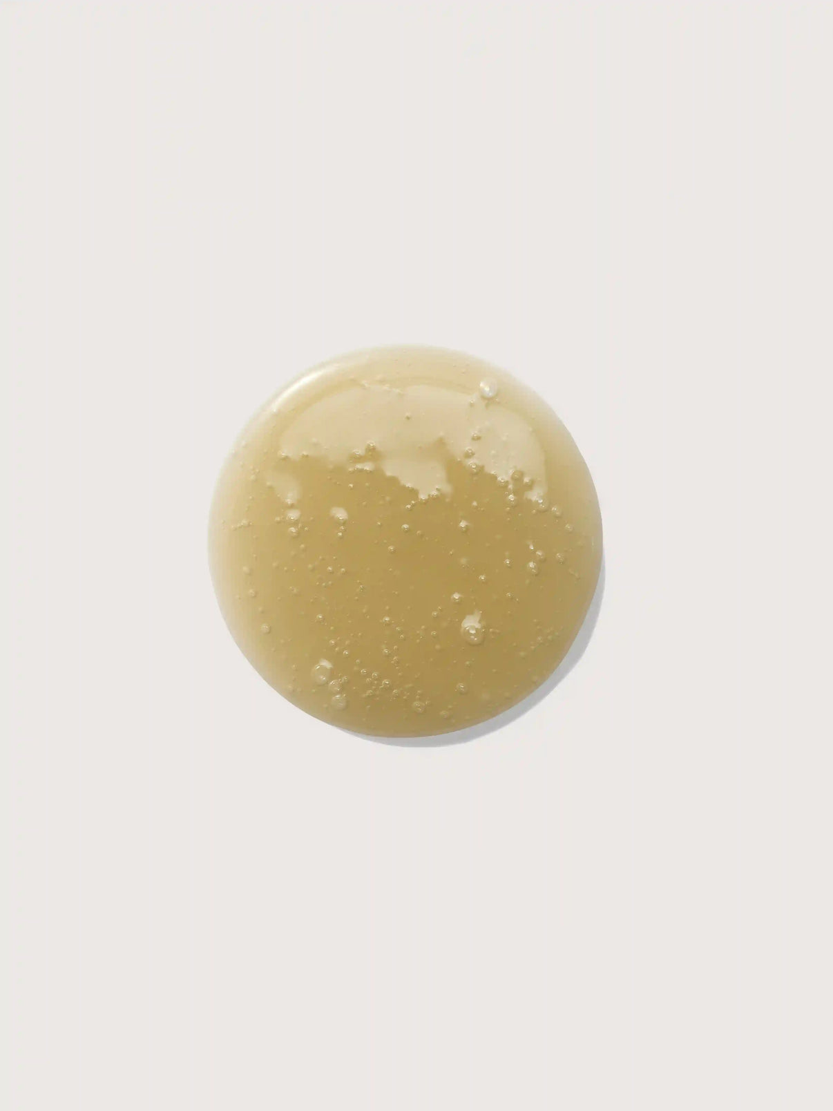 Golden nourishing oil with bubbles, sea minerals