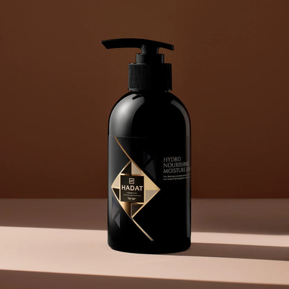 Black Hadat Hydro Nourishing Moisture Shampoo bottle with gold label on warm brown background