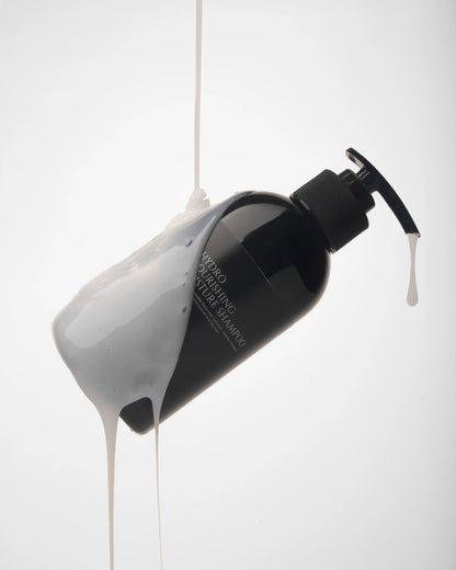 Hydro nourishing moisture shampoo bottle with creamy product pouring out