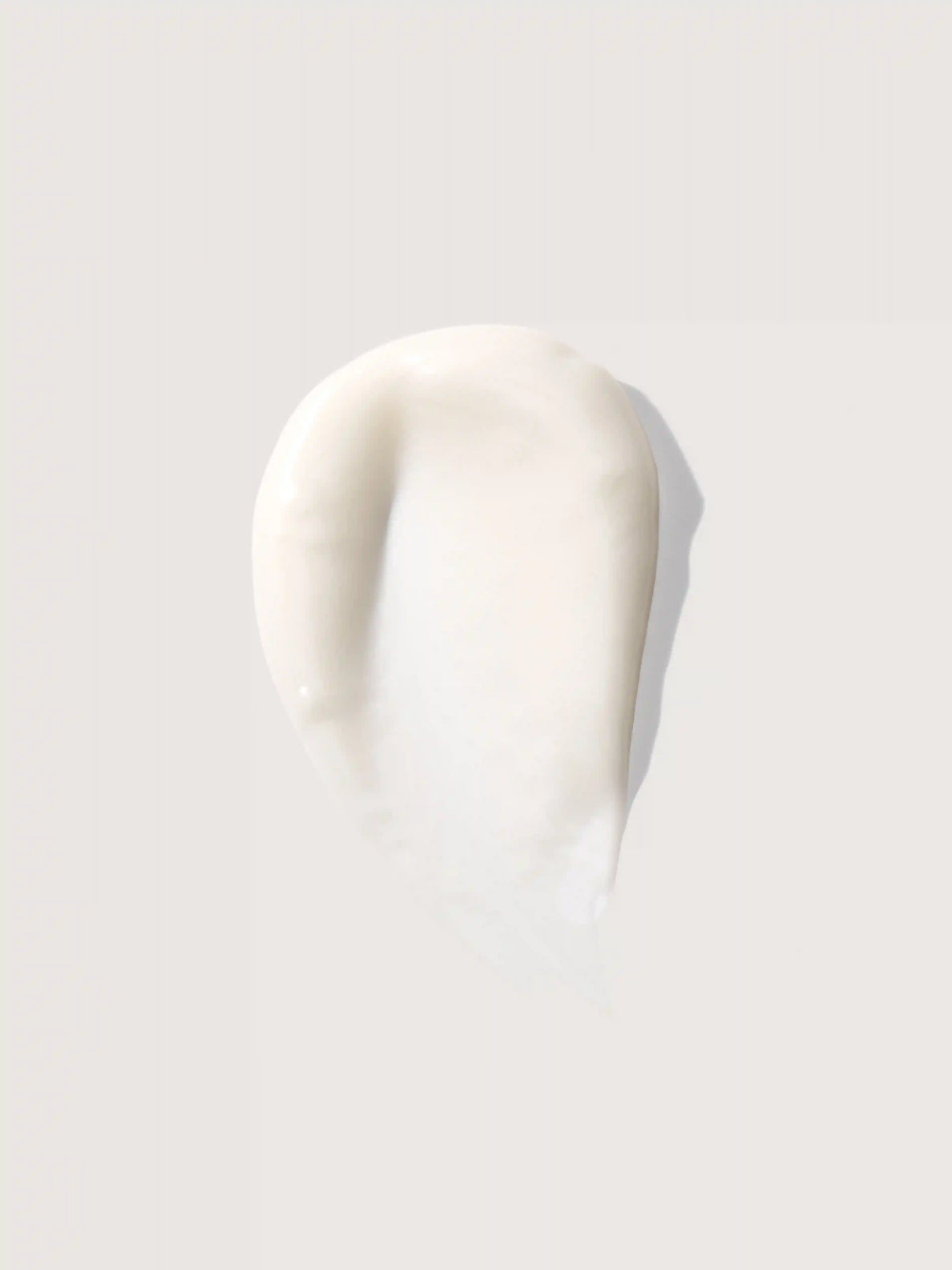 Creamy white cosmetic product smear