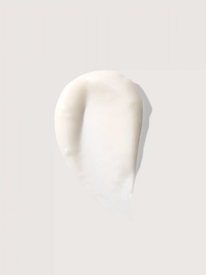 Creamy white cosmetic product smear