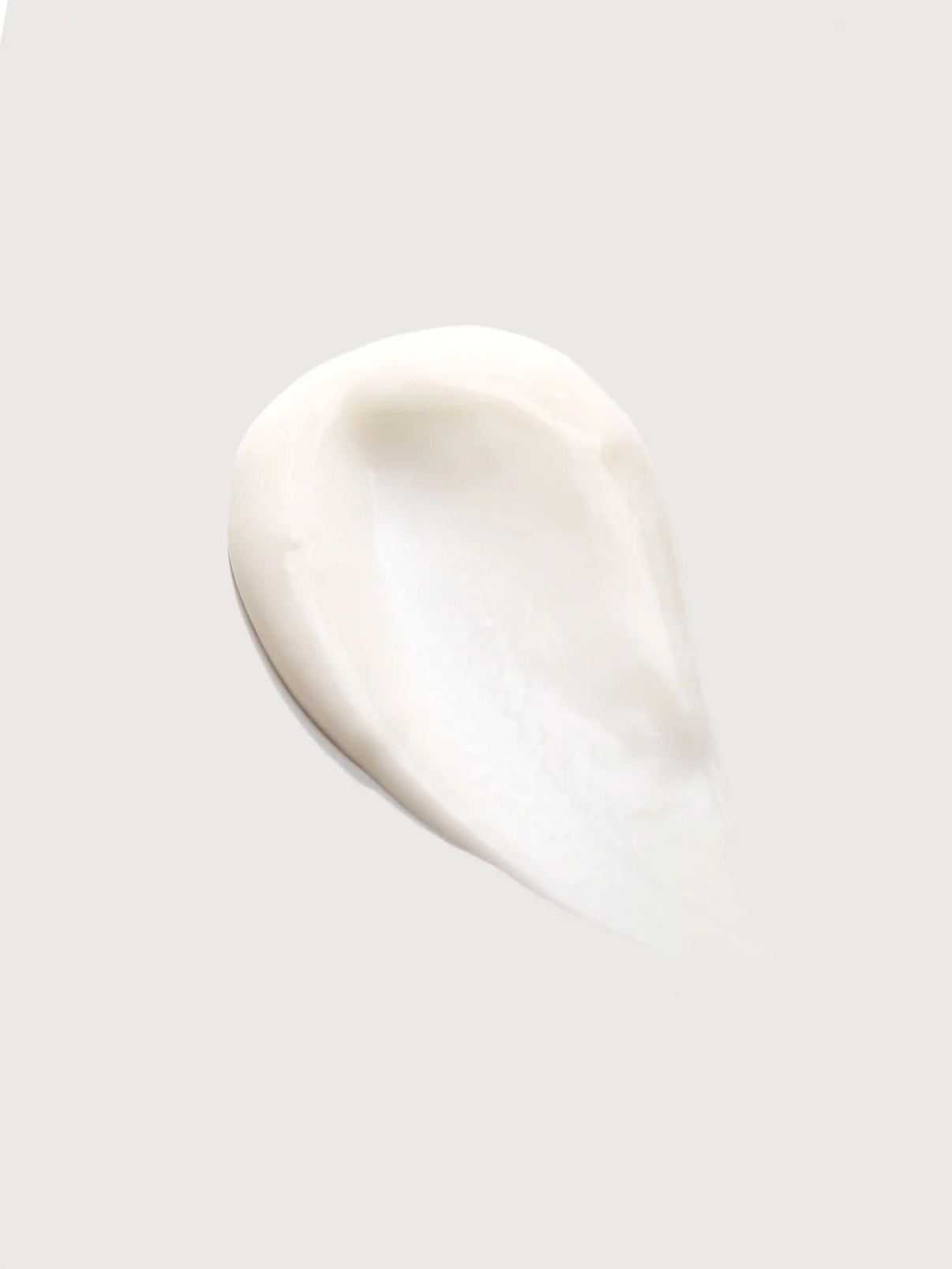 Smooth white cream swatch on light background