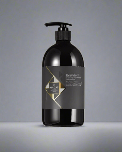 Hadat Hydro Root Strengthening Shampoo bottle with sleek black design and gold accents