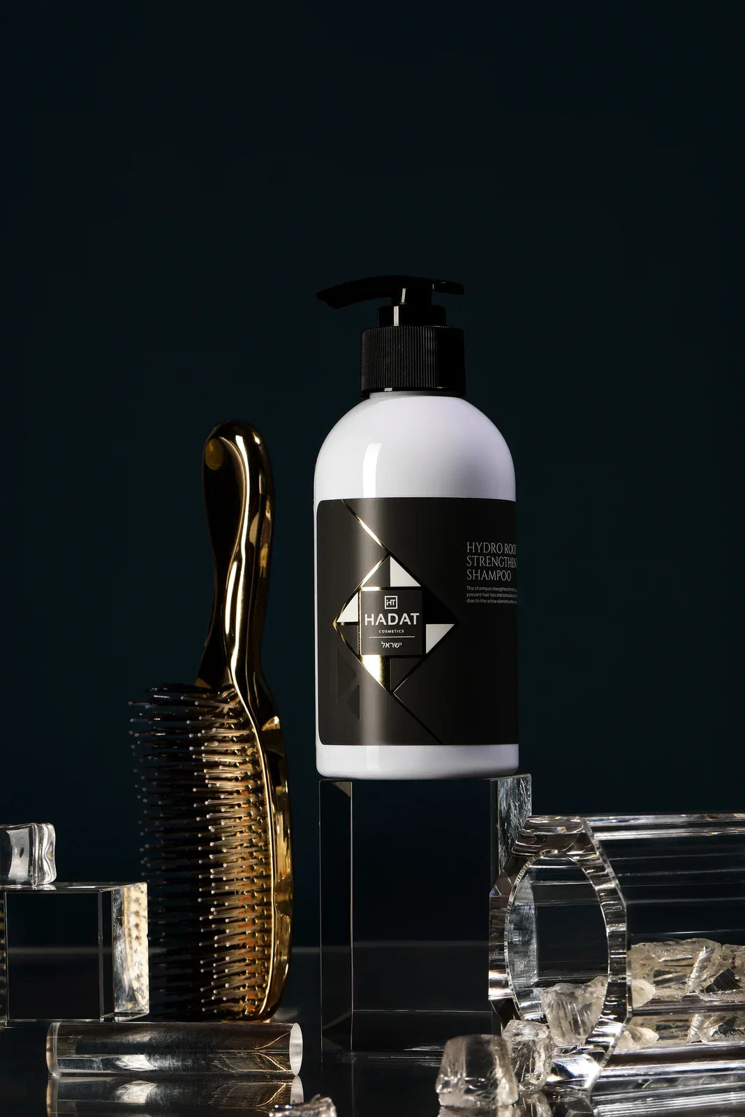 Hydro Root Strengthening Shampoo studio view with hairbrush