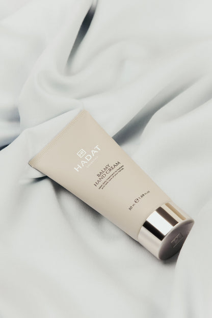 Hadat Balmy Hand Cream on soft fabric